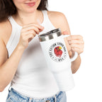 Person holding a white mug with a logo and text on a white background