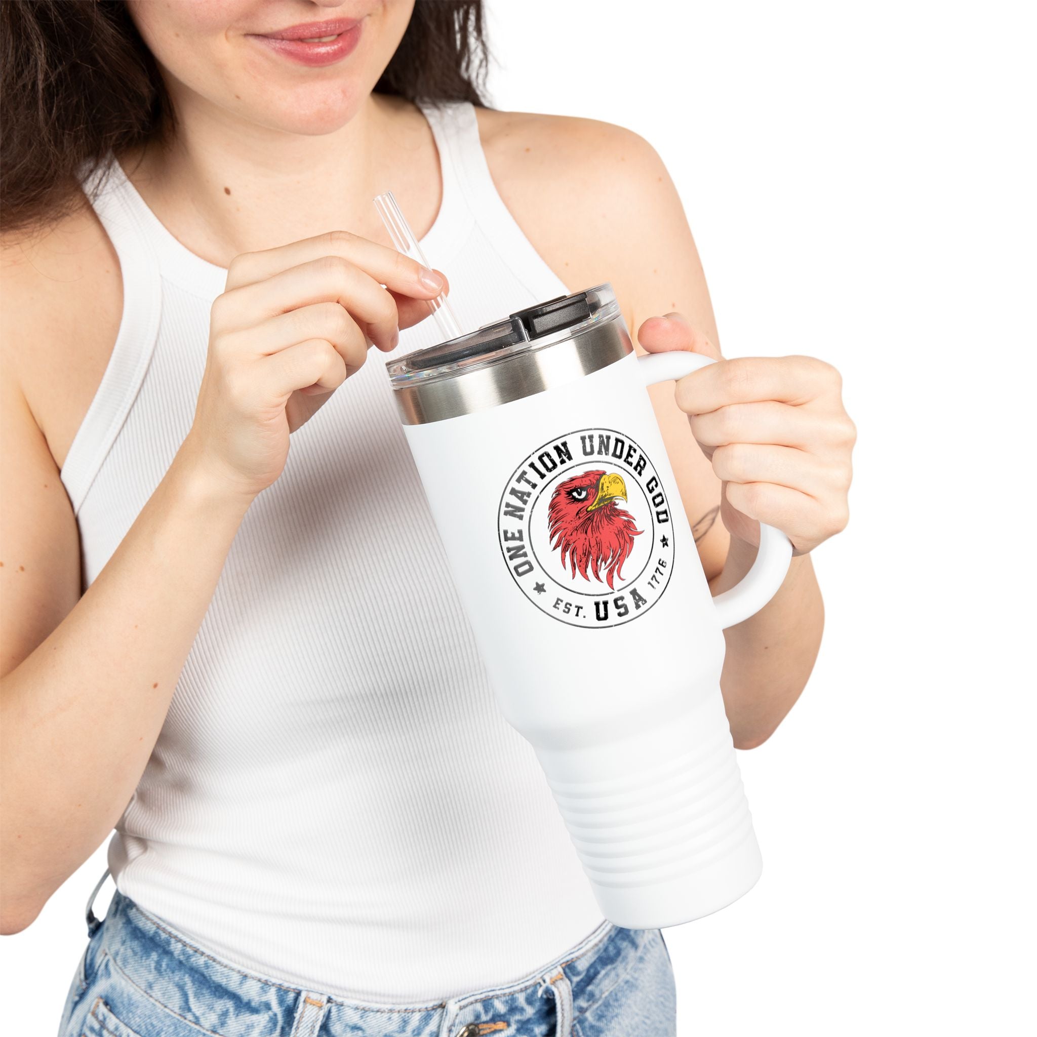 Person holding a white mug with a logo and text on a white background