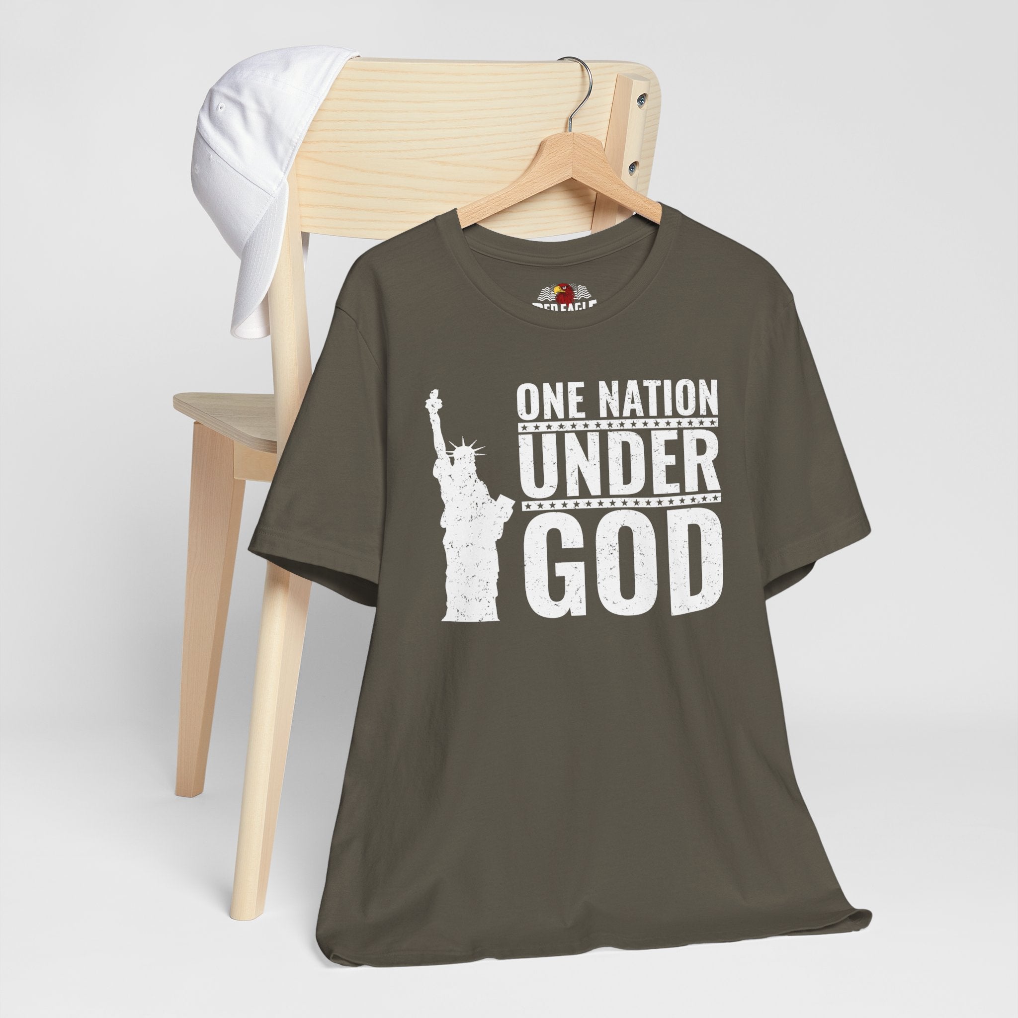 Army t-shirt with 'One Nation Under God' graphic on a hanger against a white background