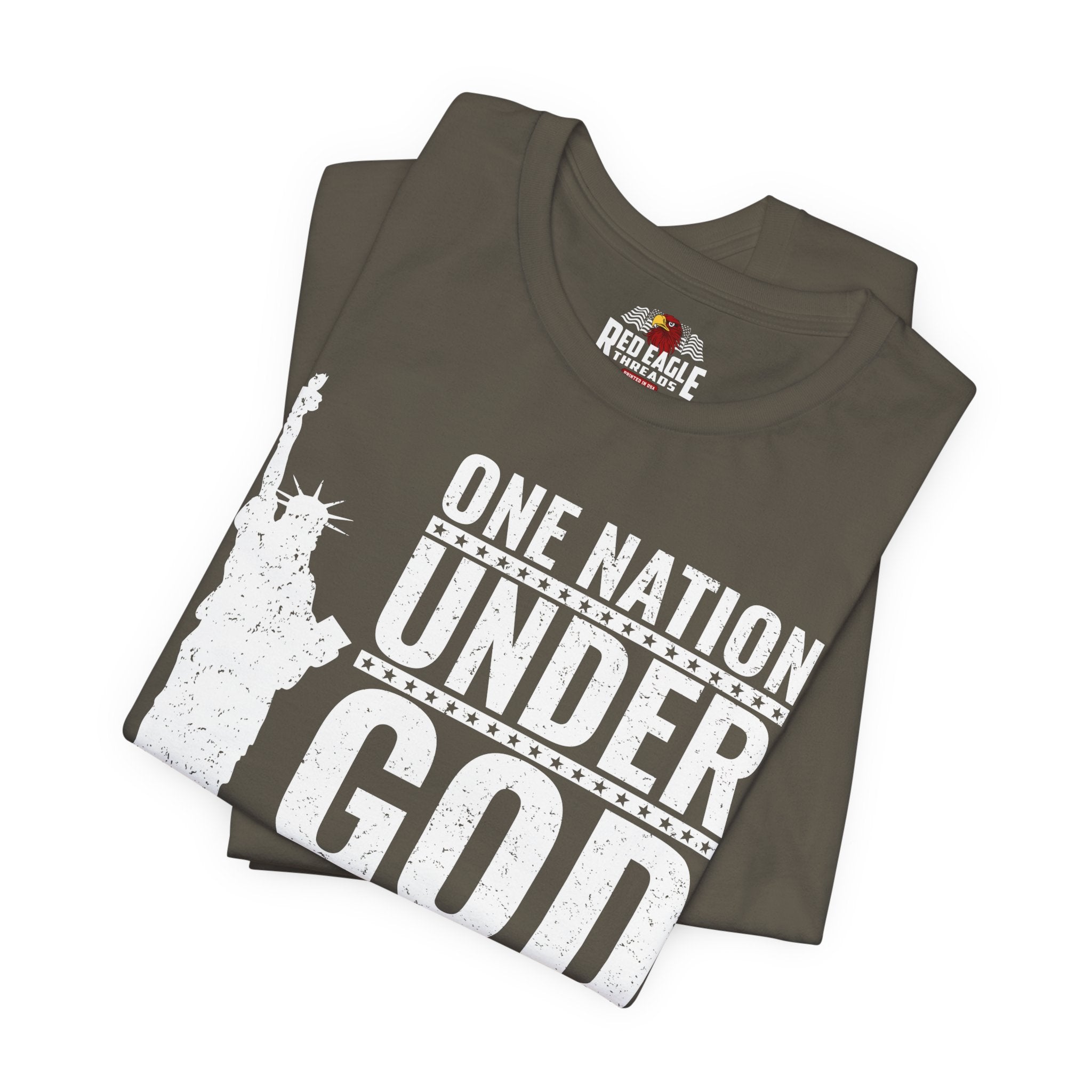 Stack of t-shirts with 'One Nation Under God' design and Red Eagle Athletics logo.