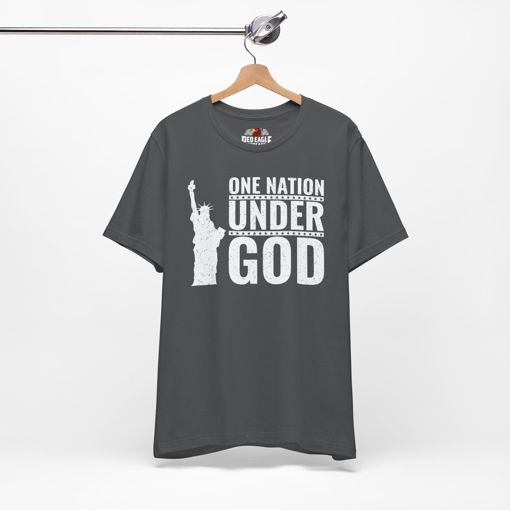 Asphalt t-shirt with 'One Nation Under God' text and Statue of Liberty graphic on a hanger.