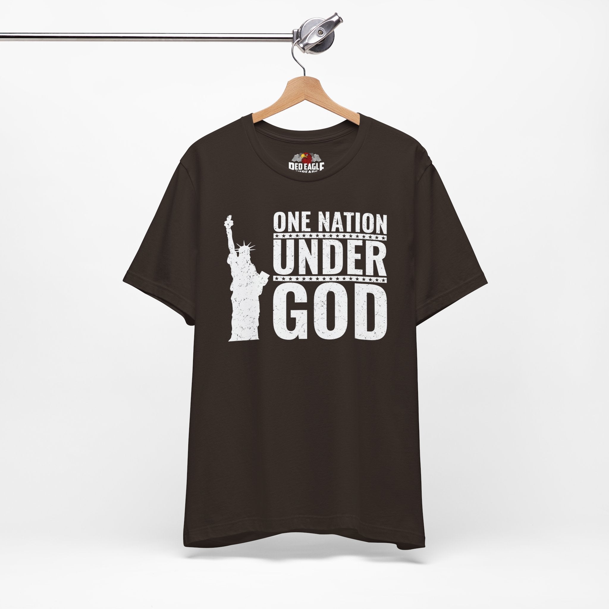 Brown t-shirt with 'One Nation Under God' graphic on a hanger against a white background
