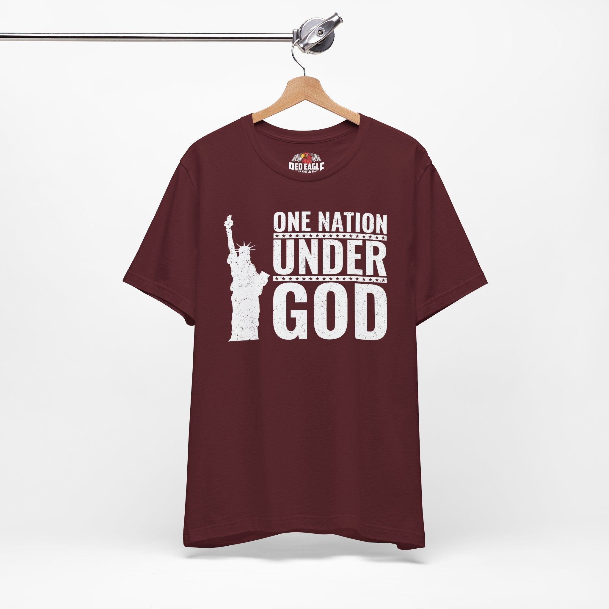 Maroon t-shirt with 'One Nation Under God' graphic on a hanger against a white background