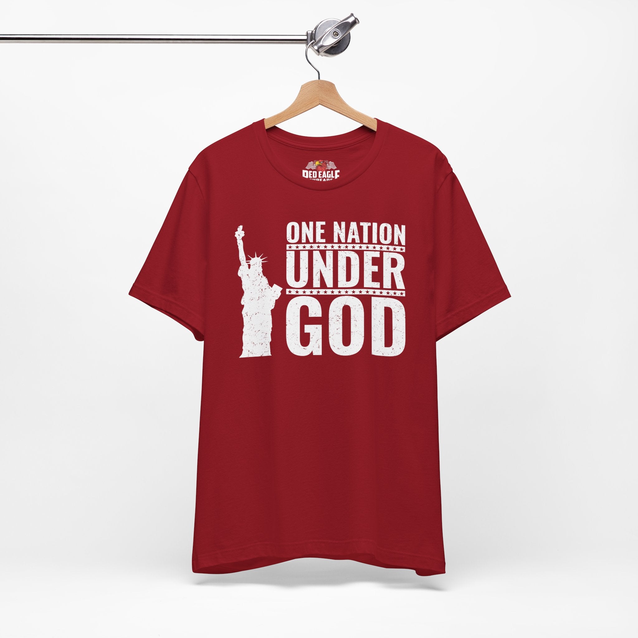 Red t-shirt with 'One Nation Under God' graphic on a hanger against a white background