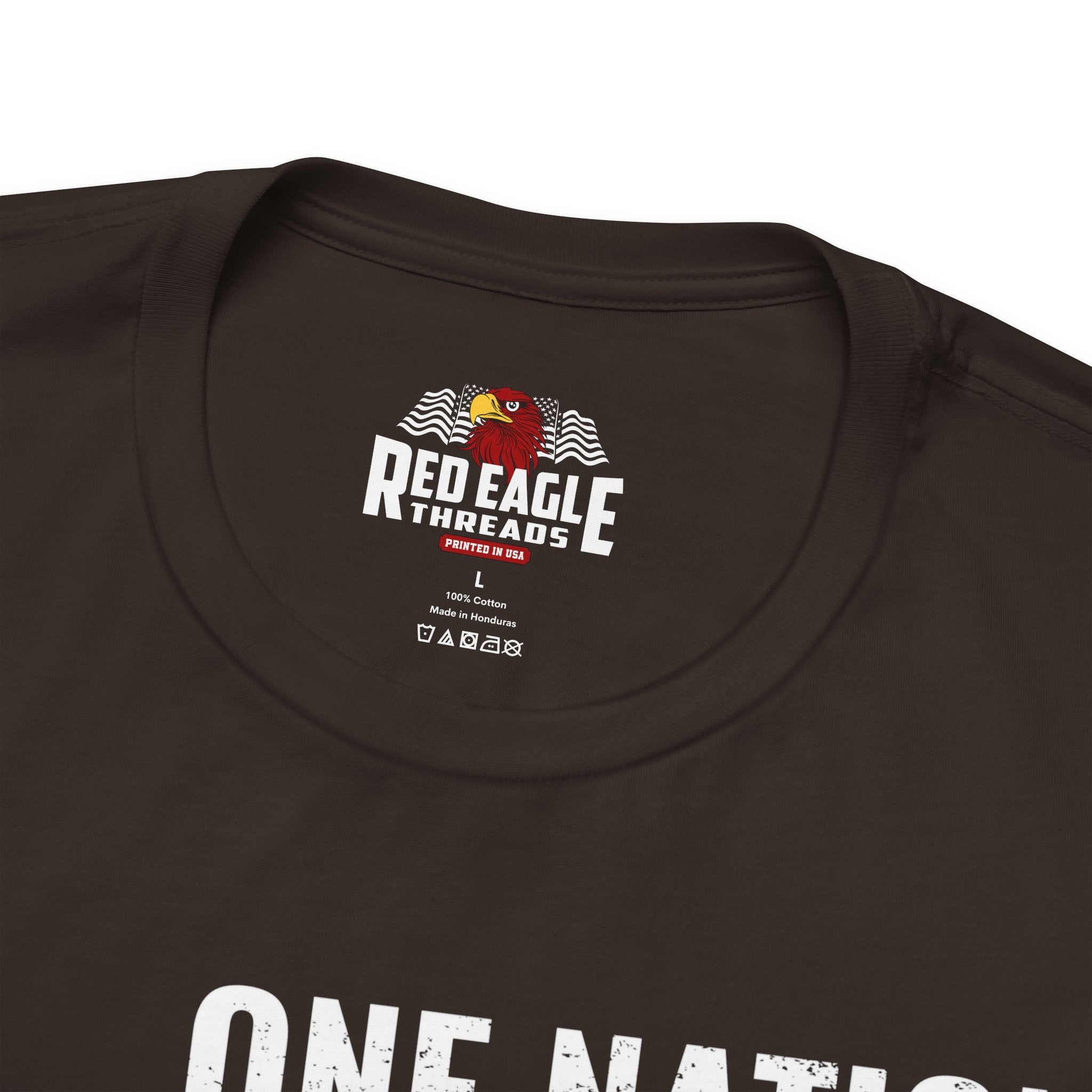 Close-up of a dark brown t-shirt with 'Red Eagle Threads' logo and text.
