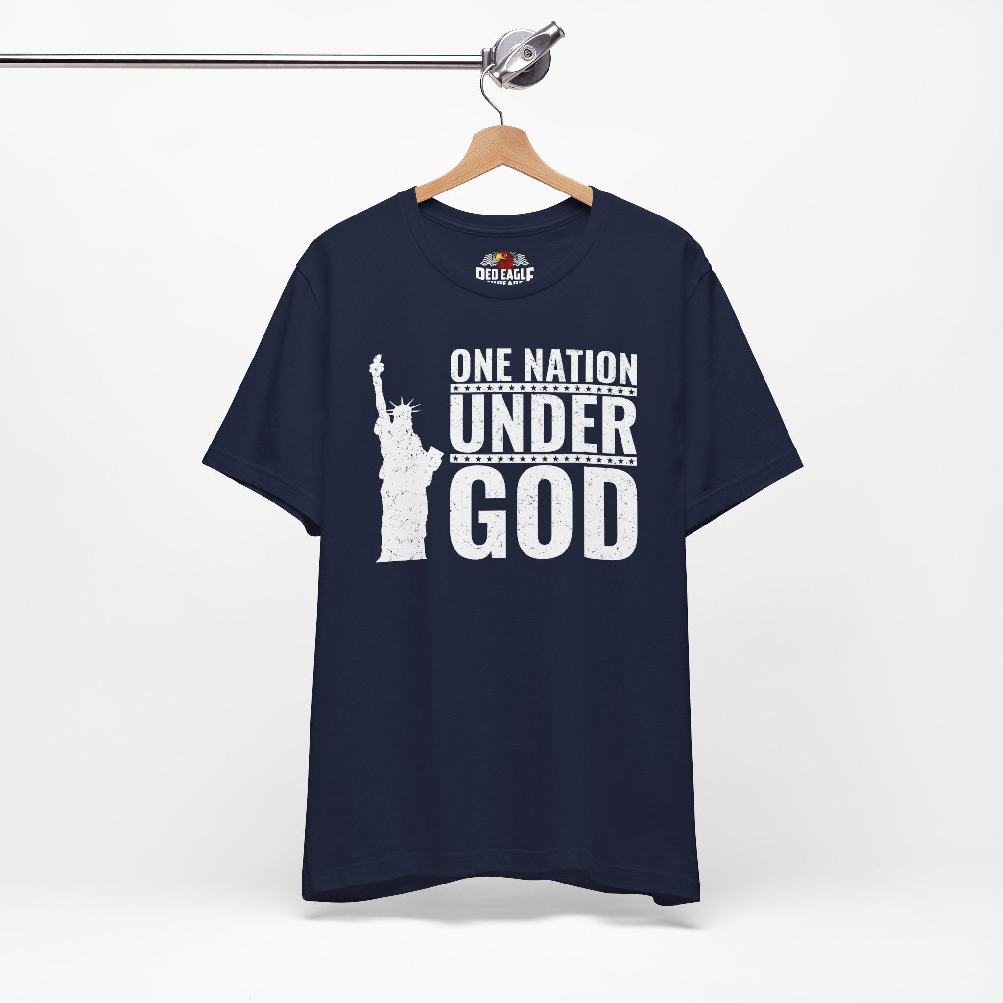 Navy blue t-shirt with 'One Nation Under God' graphic on a hanger against a white background
