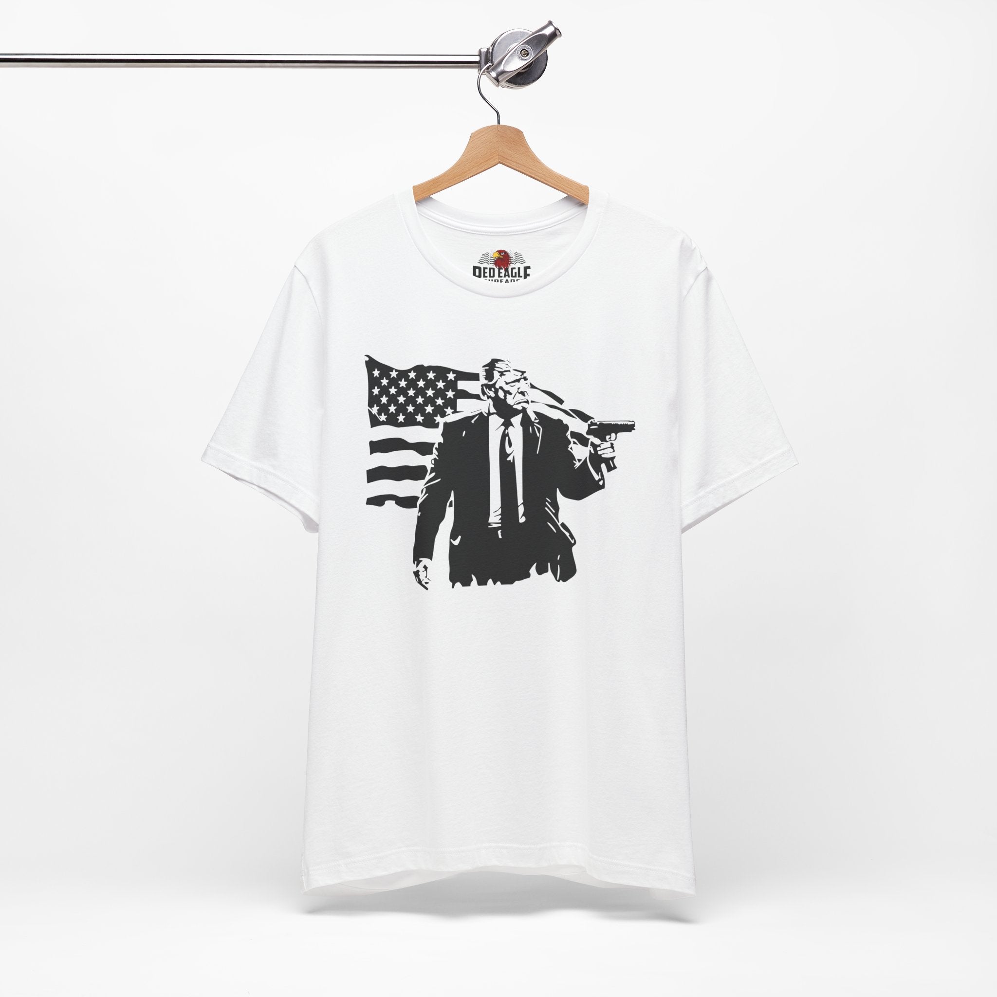 White t-shirt with black graphic design on a hanger against a white background