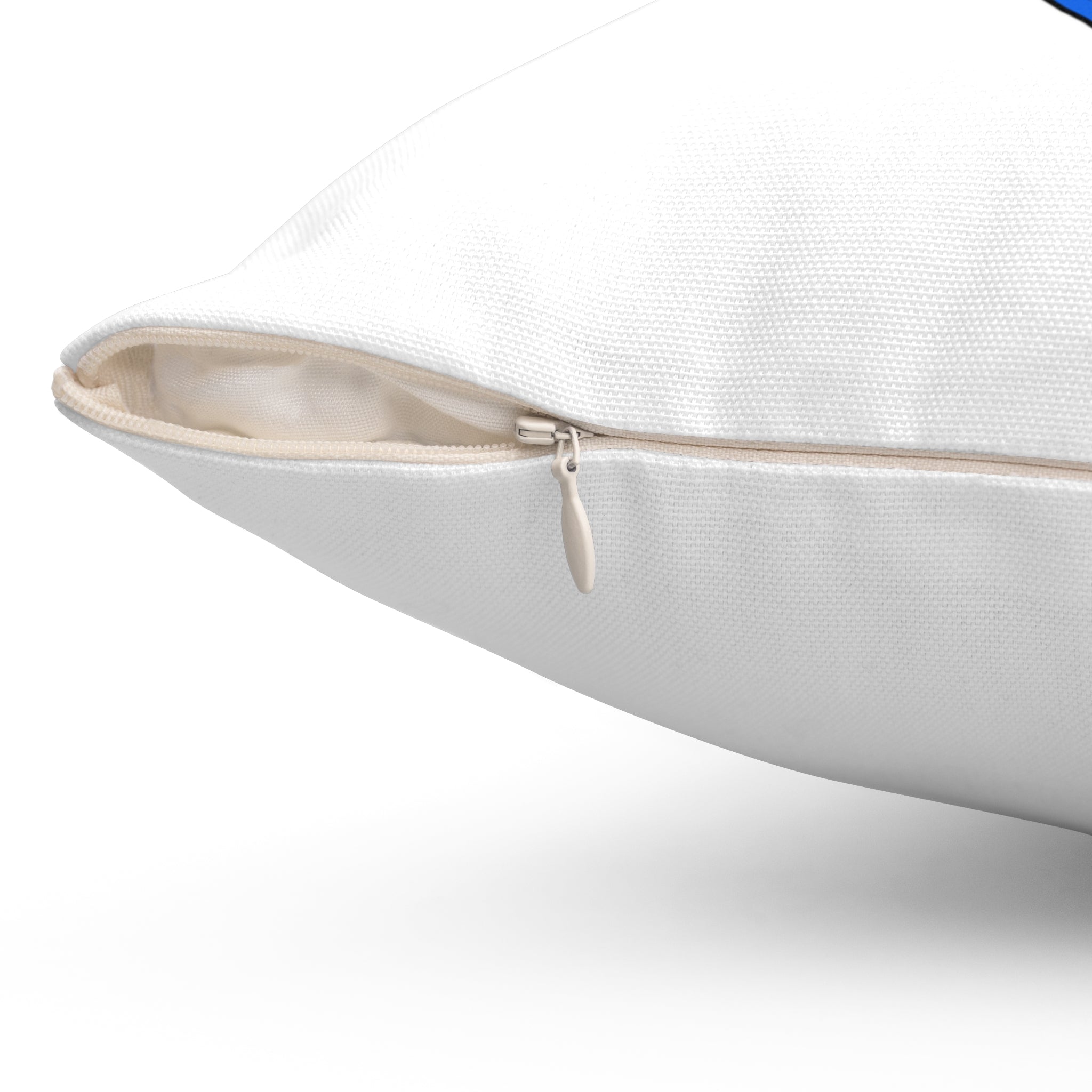 Close-up of a white pillow with a zipper on a white background