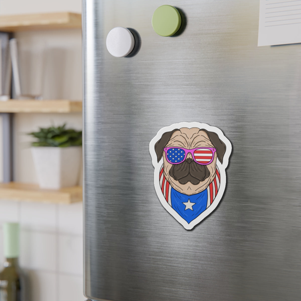 Fridge magnet of a pug wearing American flag sunglasses on a metallic refrigerator.