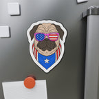 Fridge magnet of a pug wearing American flag sunglasses and bandana on a metallic surface.