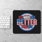 Black mouse pad with 'Red White and Better Than You' text on a marble surface with a keyboard.