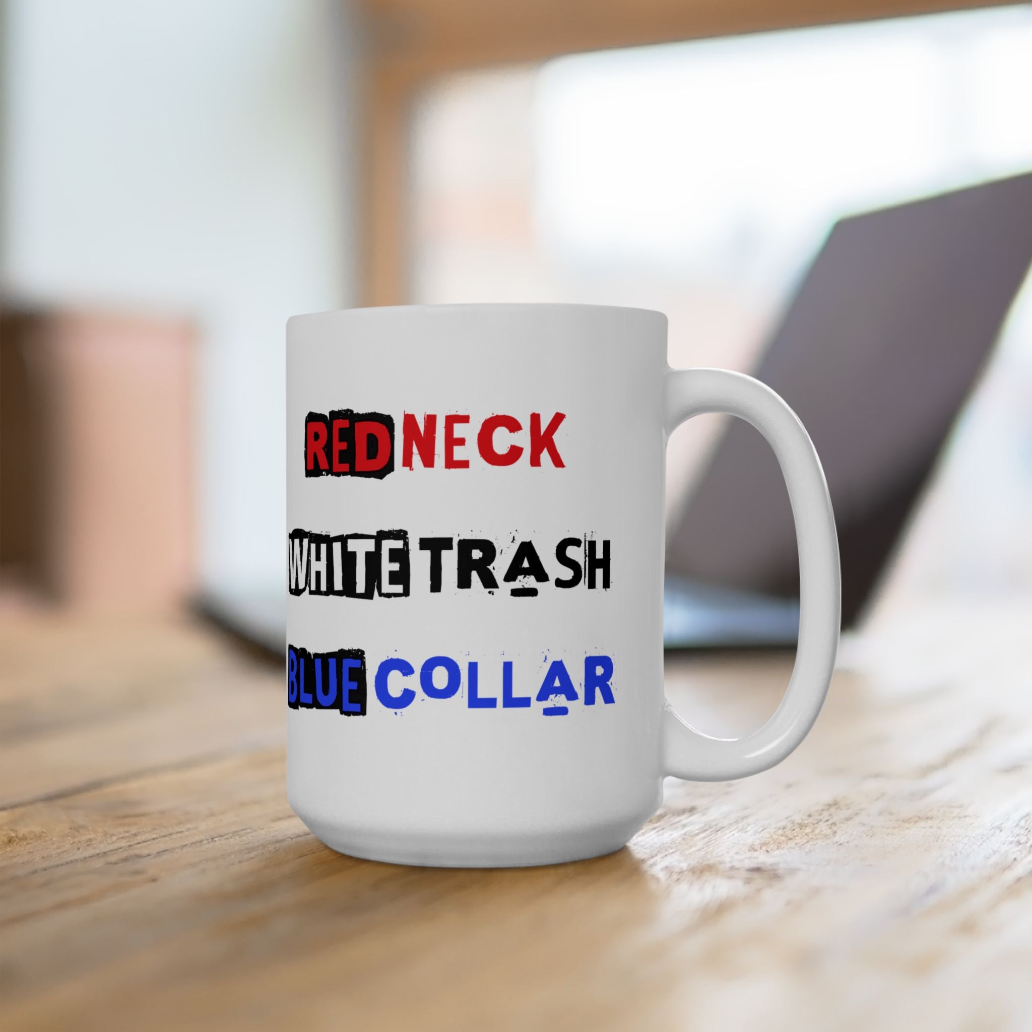 White mug with text 'RED NECK', 'WHITE TRASH', 'BLUE COLLAR' on a wooden surface.