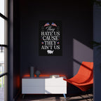 Poster with text and American flags on a dark wall in a room with a red chair and white cabinet.