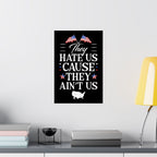 Framed poster with text and American flags on a wall above a desk.