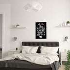 Bedroom with a motivational poster on the wall