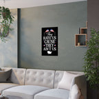 Wall art with text and flags on a gray wall above a sofa.