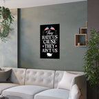 Living room with a gray wall, white sofa, and a framed poster with text and flags.