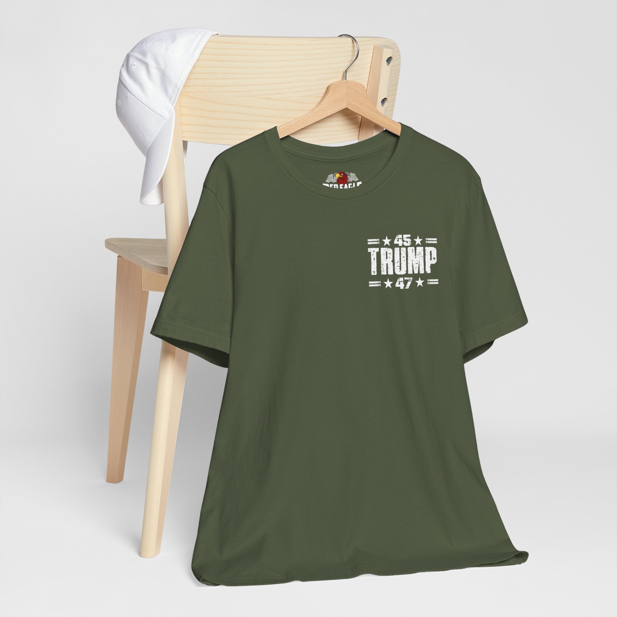 Military Green t-shirt with '45 Trump 47' text on a hanger against a white background