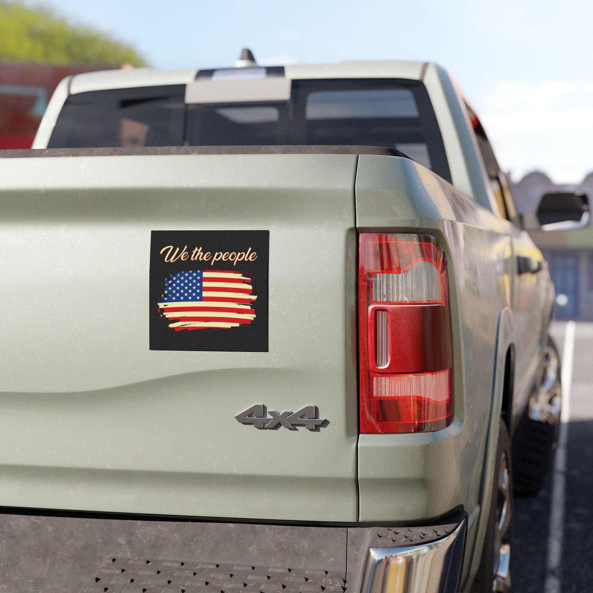 Back of a truck with 'We the people' and American flag sticker