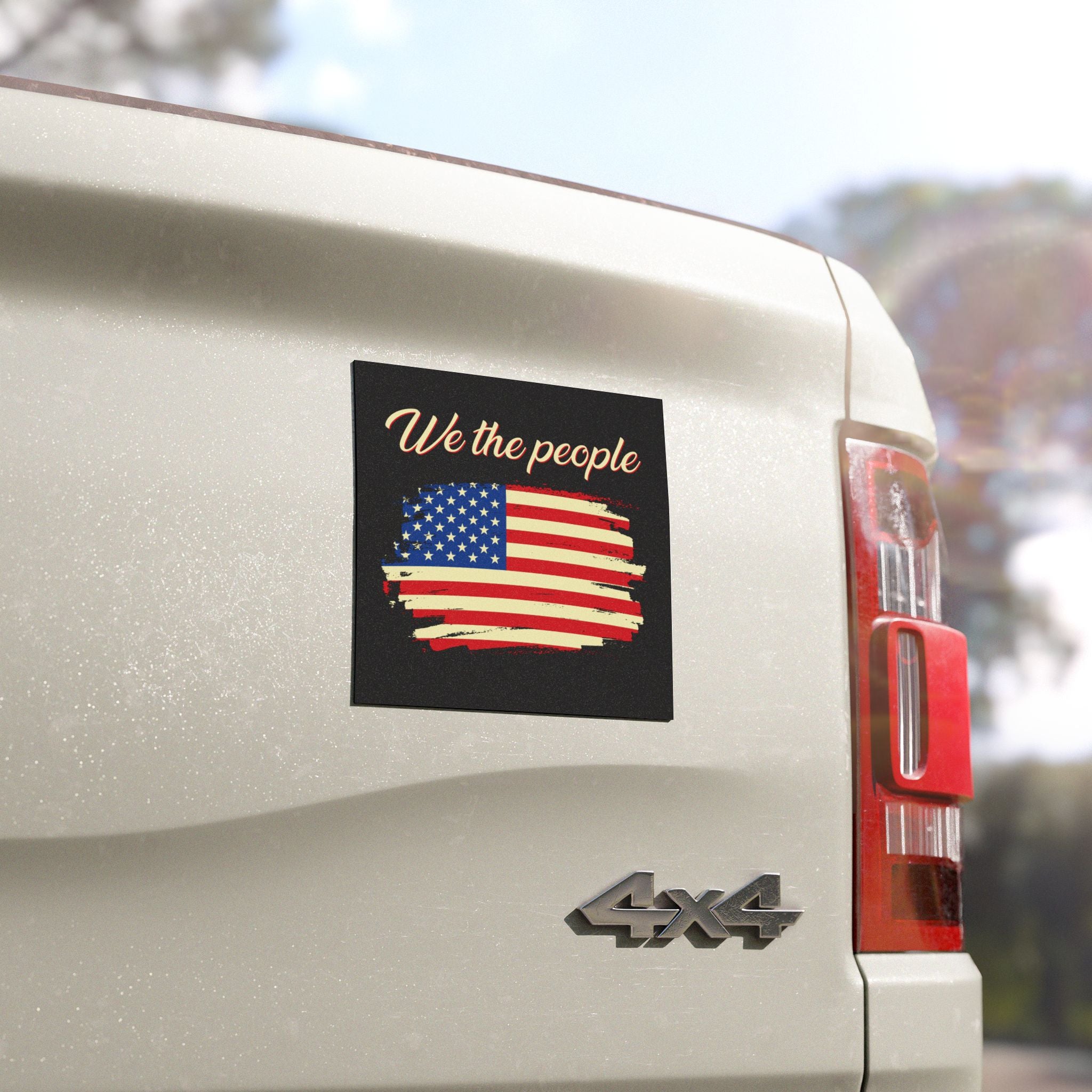 Car with a 'We the people' sticker featuring an American flag on the back