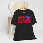 Black t-shirt with text and American flag design on a hanger against a white background