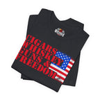 Vintage Black t-shirt with 'Cigars Whiskey Guns & Freedom' text and American flag design on a white background.