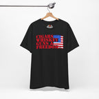 Black t-shirt with 'Cigars Whiskey Guns & Freedom' text and American flag design on a hanger.