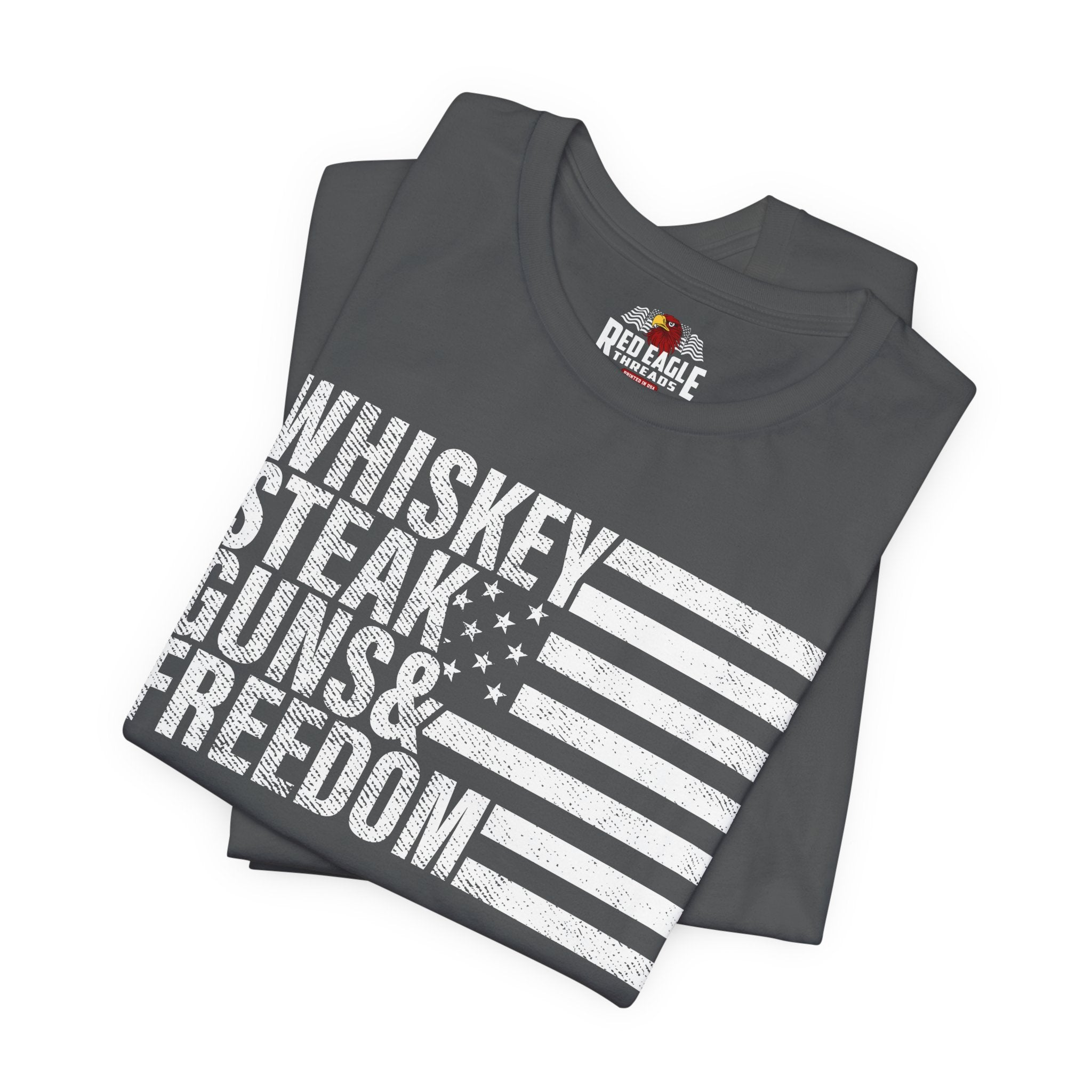 Asphalt t-shirt with 'Whiskey, Steak, Guns & Freedom' text and Red Eagle logo on a white background