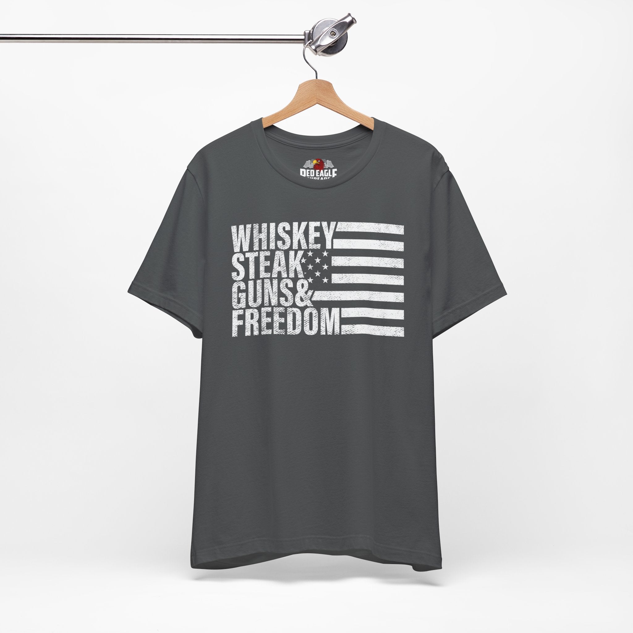Asphalt t-shirt with text and flag design on a hanger against a white background