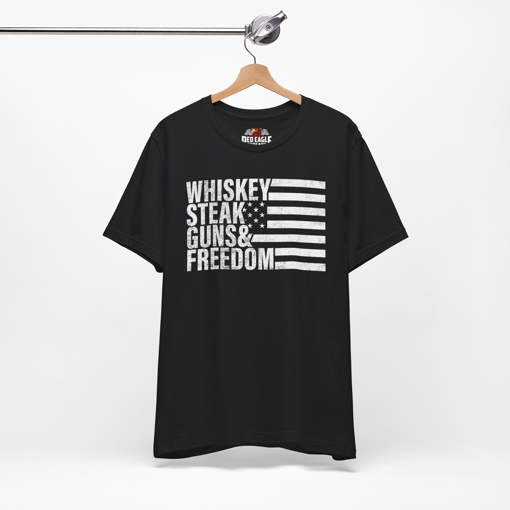 Black t-shirt with text and flag design on a hanger against a white background