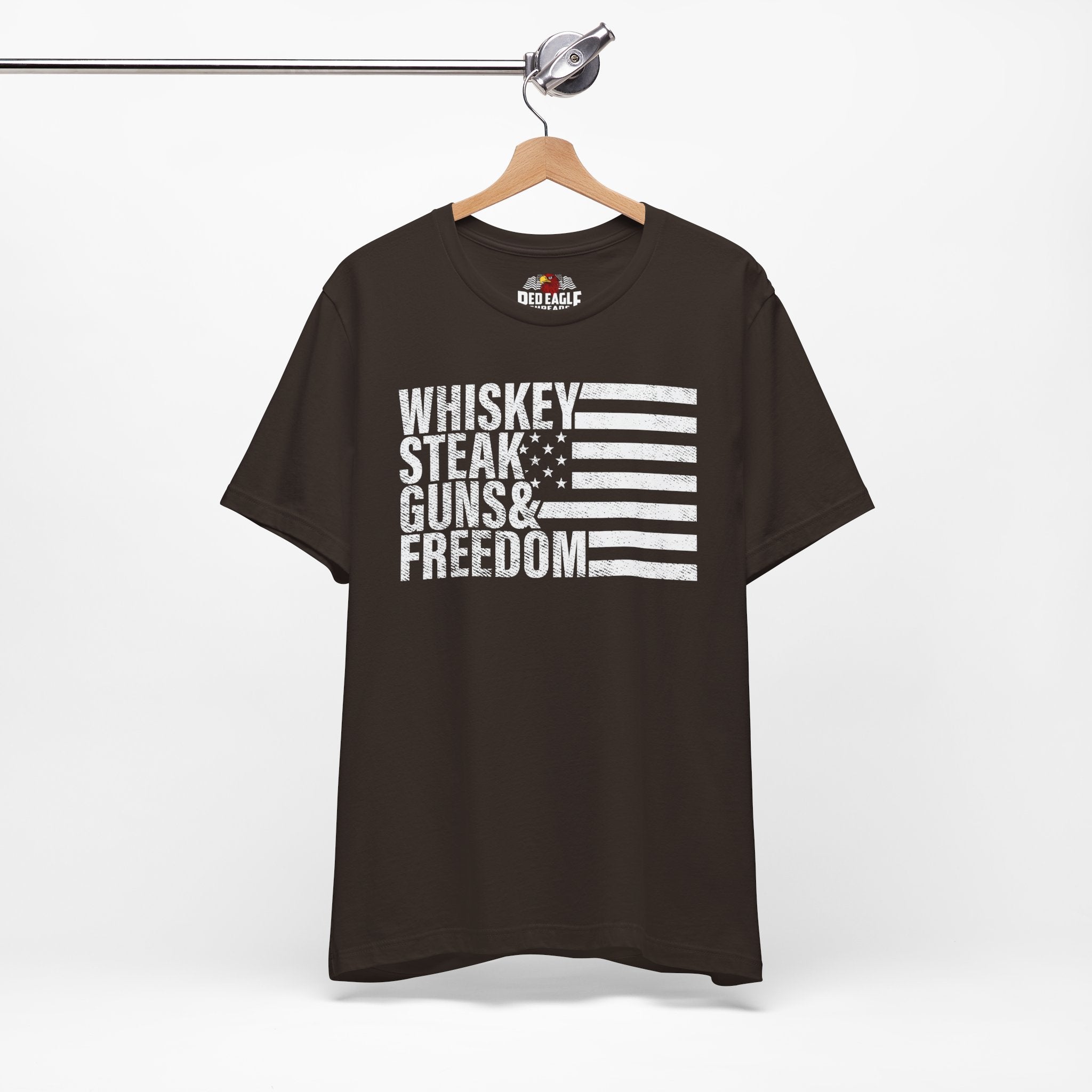 Brown t-shirt with text and flag design on a hanger against a white background