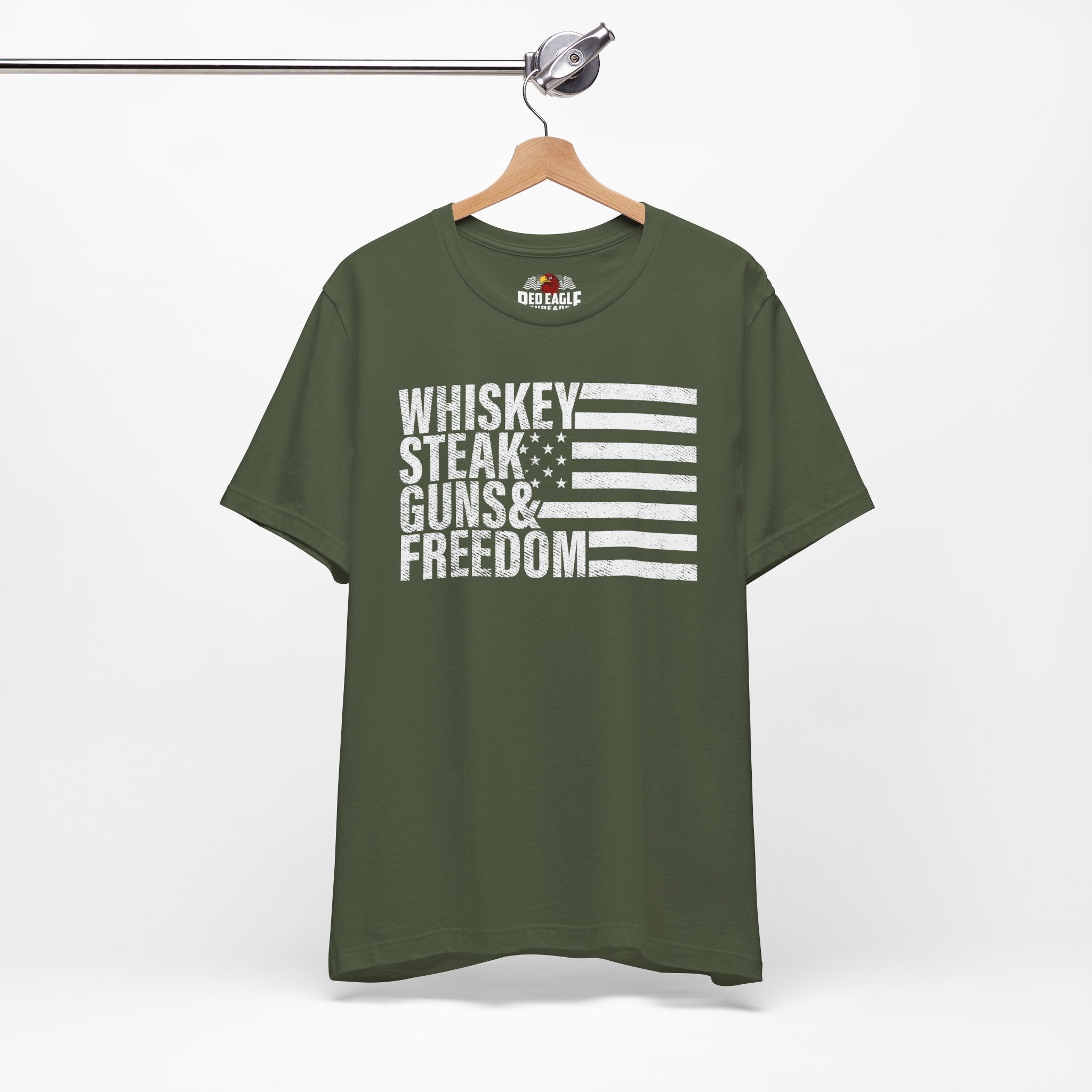 Military Green t-shirt with text and flag design on a hanger against a white background