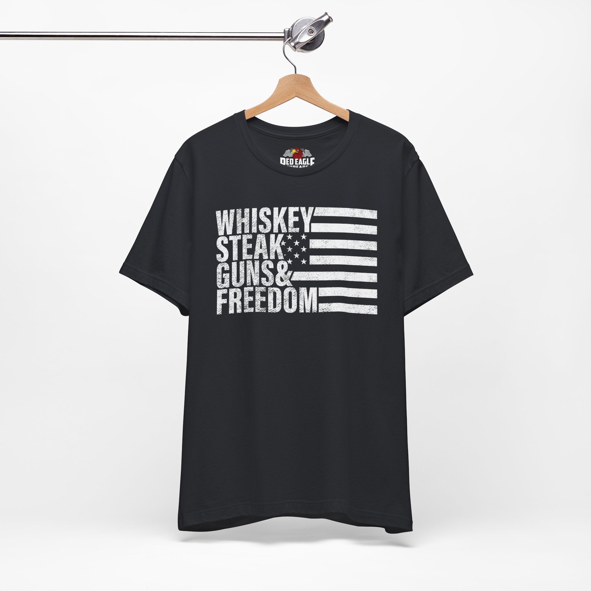 Vintage Black t-shirt with text and flag design on a hanger against a white background