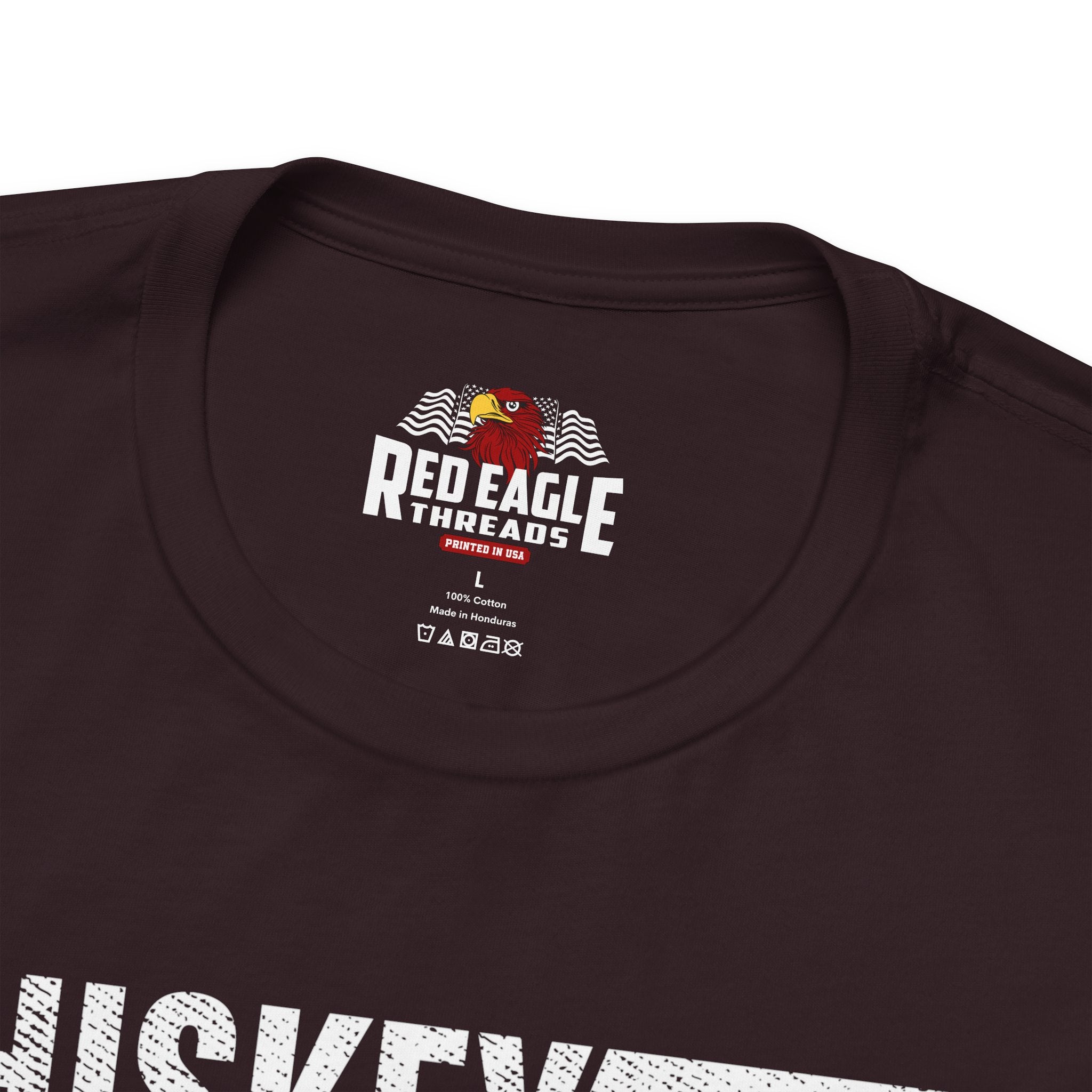 Close-up of a oxblood black t-shirt with 'Red Eagle Threads' logo on a white background