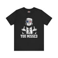 Black t-shirt with graphic of a person making an gesture and text 'YOU MISSED' on a white background