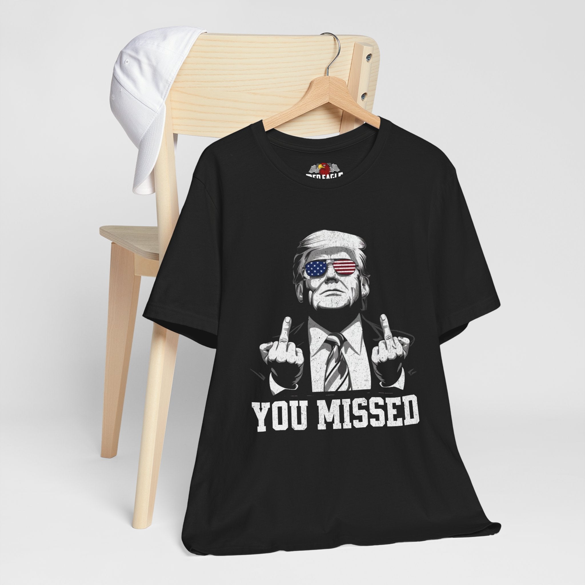 Black t-shirt with graphic design and text on a white background