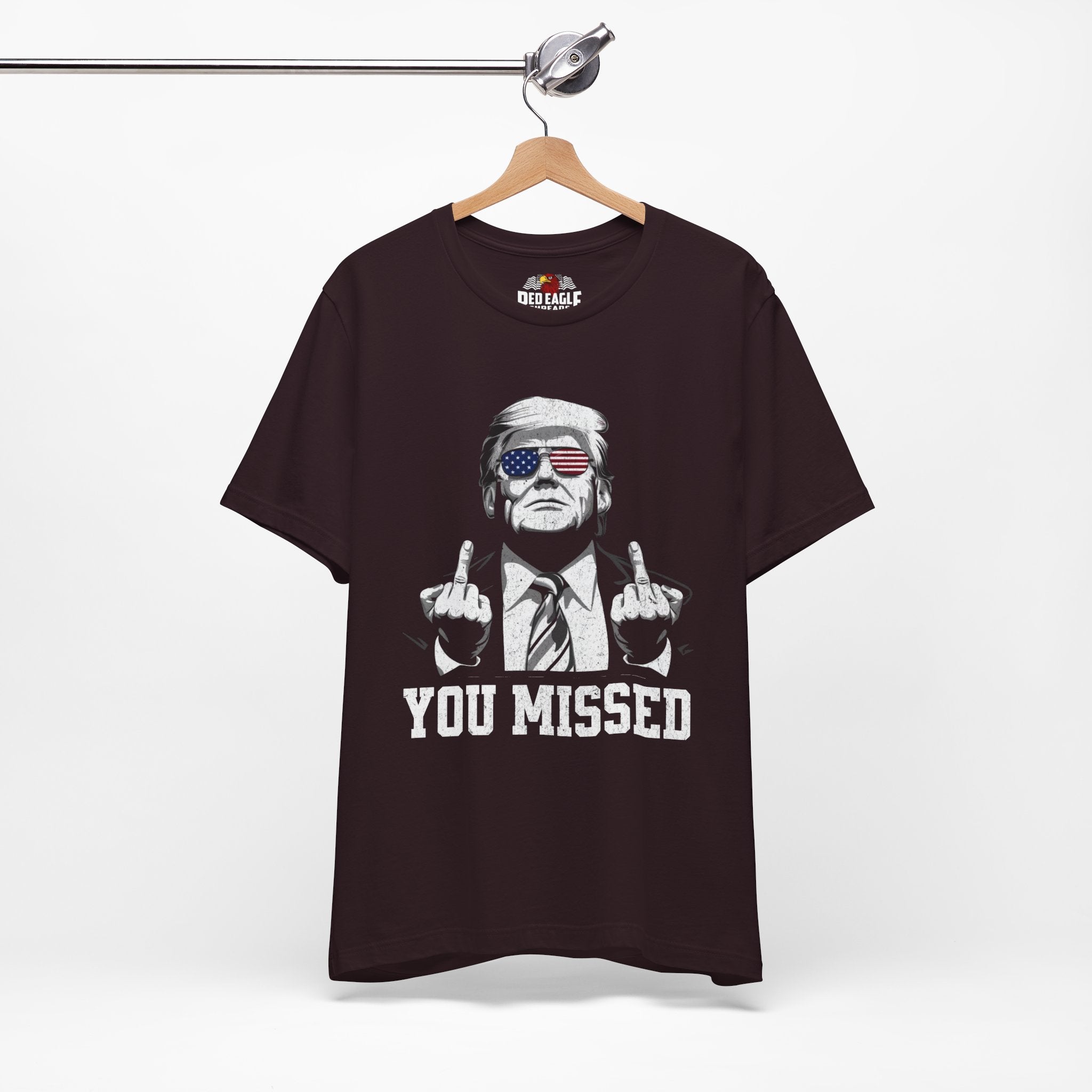 Oxblood Black t-shirt with graphic design and text on a hanger against a white background