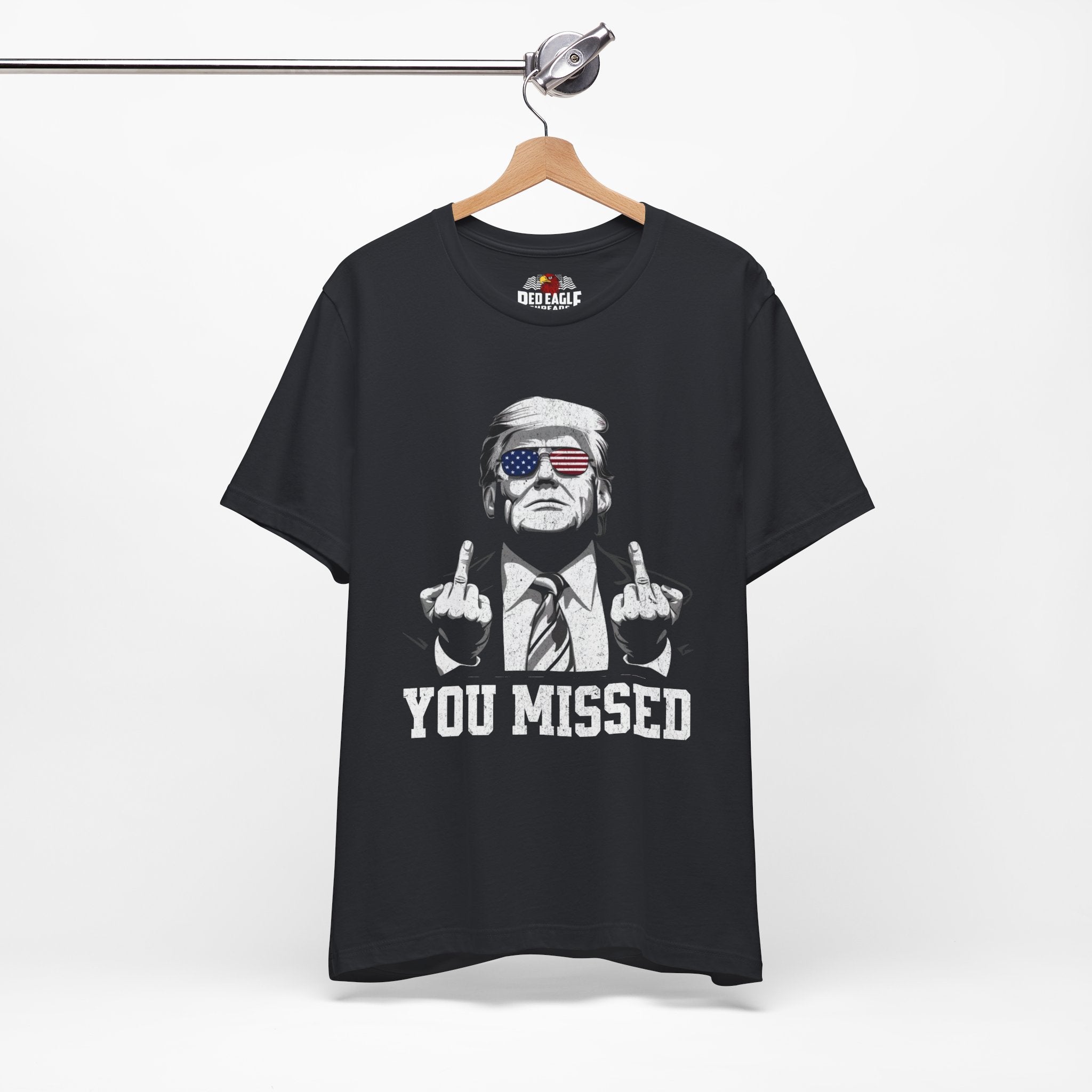 Vintage Black t-shirt with graphic design and text on a hanger against a white background